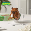 An orange Capybara micro building block figure standing on a white base.
