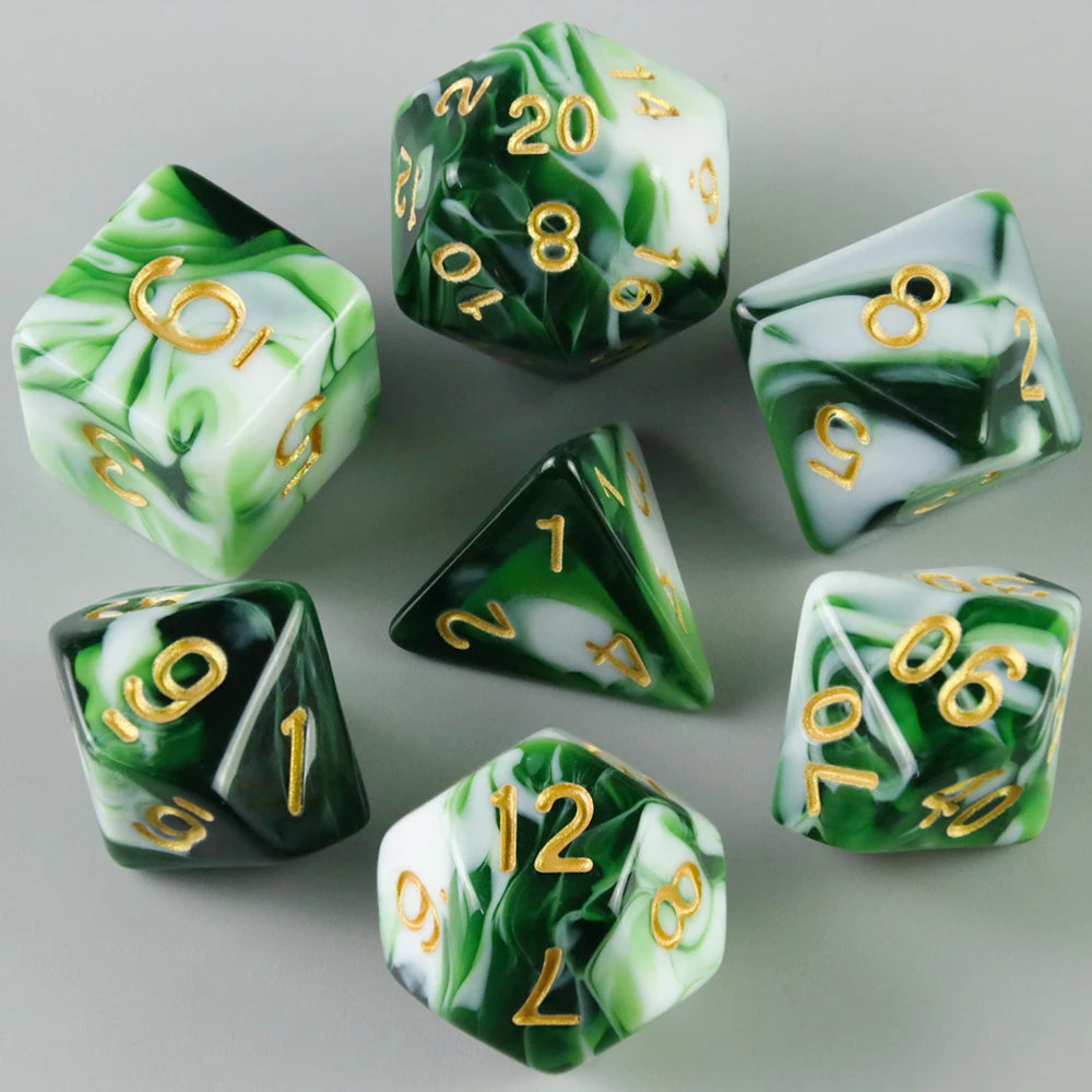 A set of green and white acrylic dice showing various numbers for tabletop gaming.