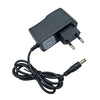 Black power supply adapter for a guitar pedal, featuring a plug and cable.