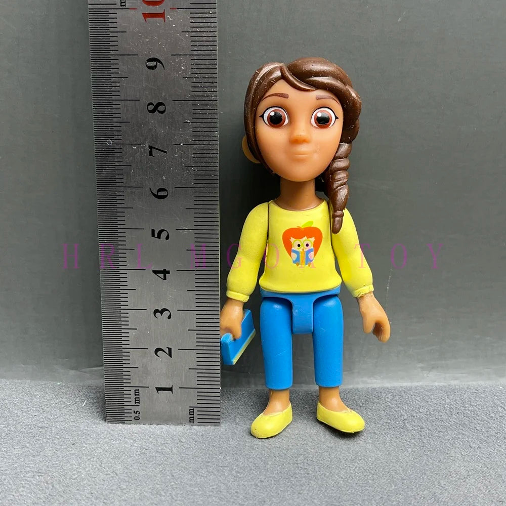 A Playful Cartoon PVC figurine of a girl with brown hair wearing a yellow shirt and blue pants.