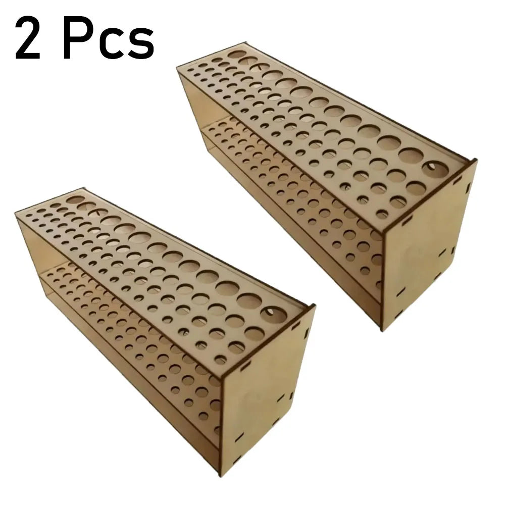 Two wooden organizers for art brushes and pencils, each featuring multiple slots.