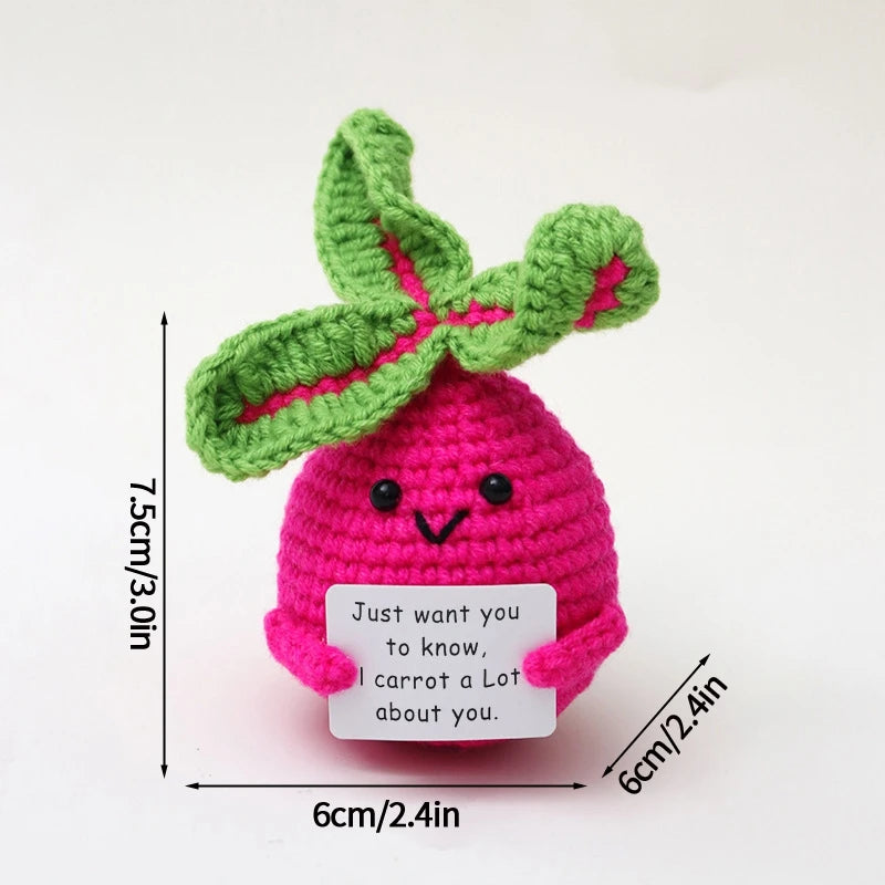 Handmade crochet pocket hug doll featuring a pink body and green leaf, with a white tag that reads I carrot a lot about you.