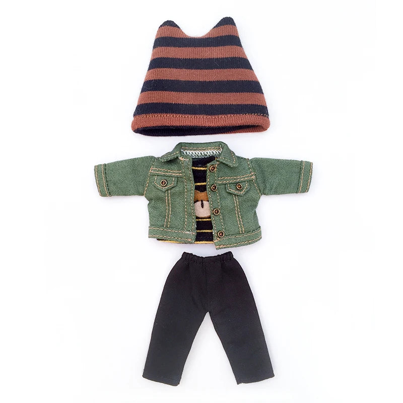 A green denim jacket for a 1/12 scale doll displayed next to a striped knit hat and black pants.