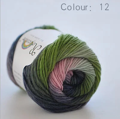A ball of soft, hand-dyed merino wool yarn in a shade of green is shown against a white background.