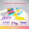 A collection of clear jelly soft blocks in various colors including purple, blue, and yellow arranged on a white surface.
