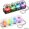 A set of four clear plastic keyboard fidget toys with colorful LED lights attached to silver chains.