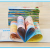 A stack of colorful pocket books for early learning, featuring various English words and pictures.