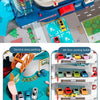 Dinosaur rail car adventure playset featuring a building and parking lot with various colored vehicles.
