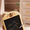 A yellow LCD writing tablet for kids is shown with a stylus on a wooden surface, demonstrating handwriting realism.