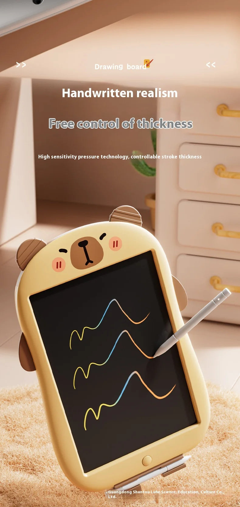 A yellow LCD writing tablet for kids is shown with a stylus on a wooden surface, demonstrating handwriting realism.