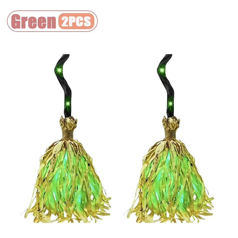 A pair of animated witch brooms with green LED glow and sound features.