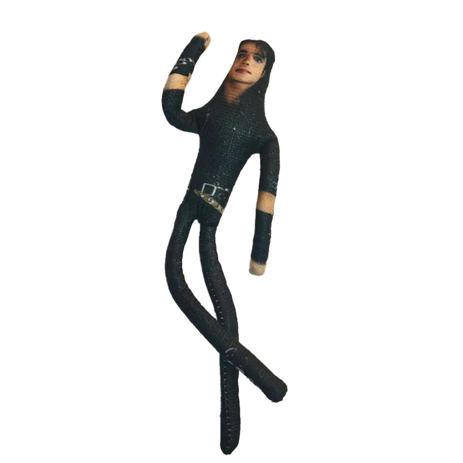 A plush doll resembling Michael Jackson with bendable limbs and dark clothing.