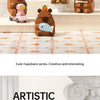 A set of cute capybara building blocks in various colors and sizes displayed on a wooden surface.