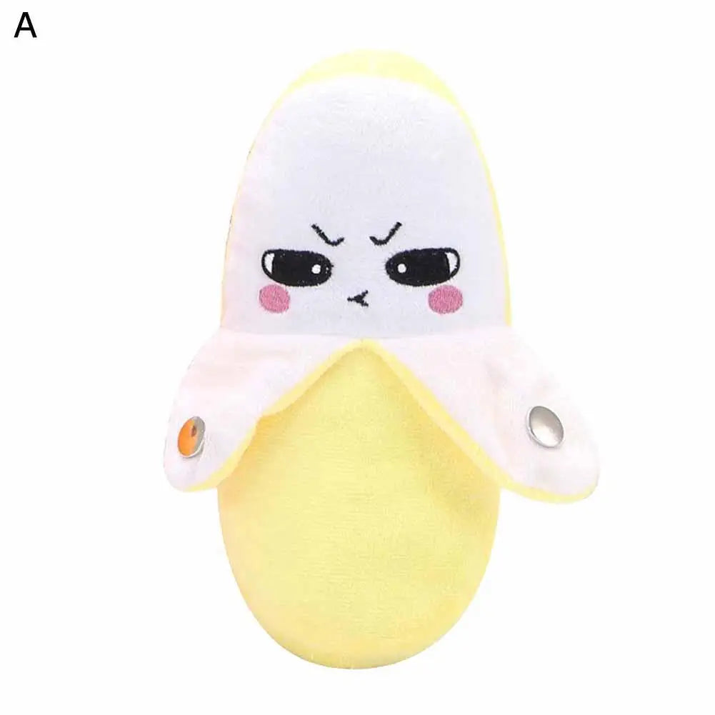 A yellow banana-shaped plush toy with a white hood and facial expression.