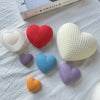A collection of silicone heart molds in various colors including white, red, light green, blue, and purple, arranged on a whi