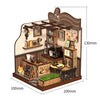 A wooden miniature dollhouse kit featuring a cafe scene with shelves, furniture, and decorative elements.