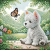 A fluffy white dog is adorned with sparkling beads and sits in a lush, green garden setting.
