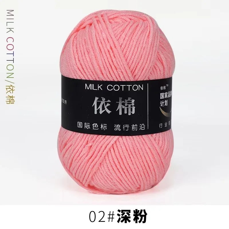 A ball of pink milk cotton yarn labeled 02# 深粉 for knitting and crochet