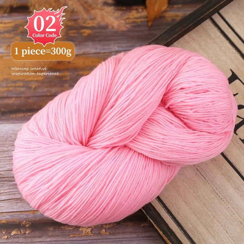 Pink yarn skein shown on a wooden surface, ready for knitting or weaving projects.