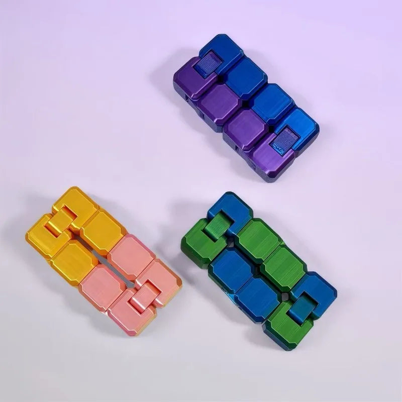 Three colorful infinity cubes arranged diagonally on a white surface.