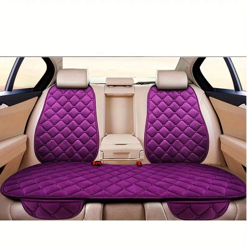 Interior view of a car seat with purple quilted cushions and beige leather upholstery.