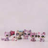 A collection of Shorthair Cat Bobble Head figurines in various colors and poses.