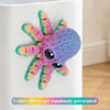 A colorful 3D printed articulated octopus fridge magnet with purple and multicolored tentacles.