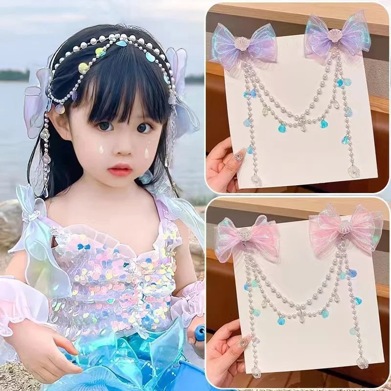 A girl wearing a pearl butterfly hair clip and a sparkly top, with a card displaying a matching necklace.