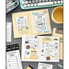 A collection of cute stationery memo pads, checklists, and writing tools arranged on a gray surface.