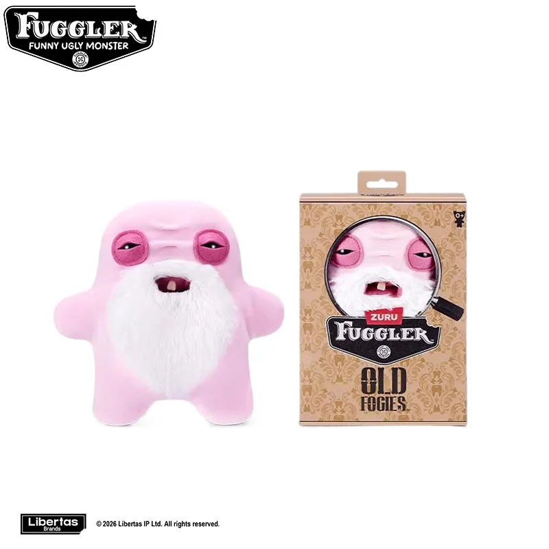 A pink Fuggler tooth monster plush toy with a white beard and pink eyes is shown next to its packaging.
