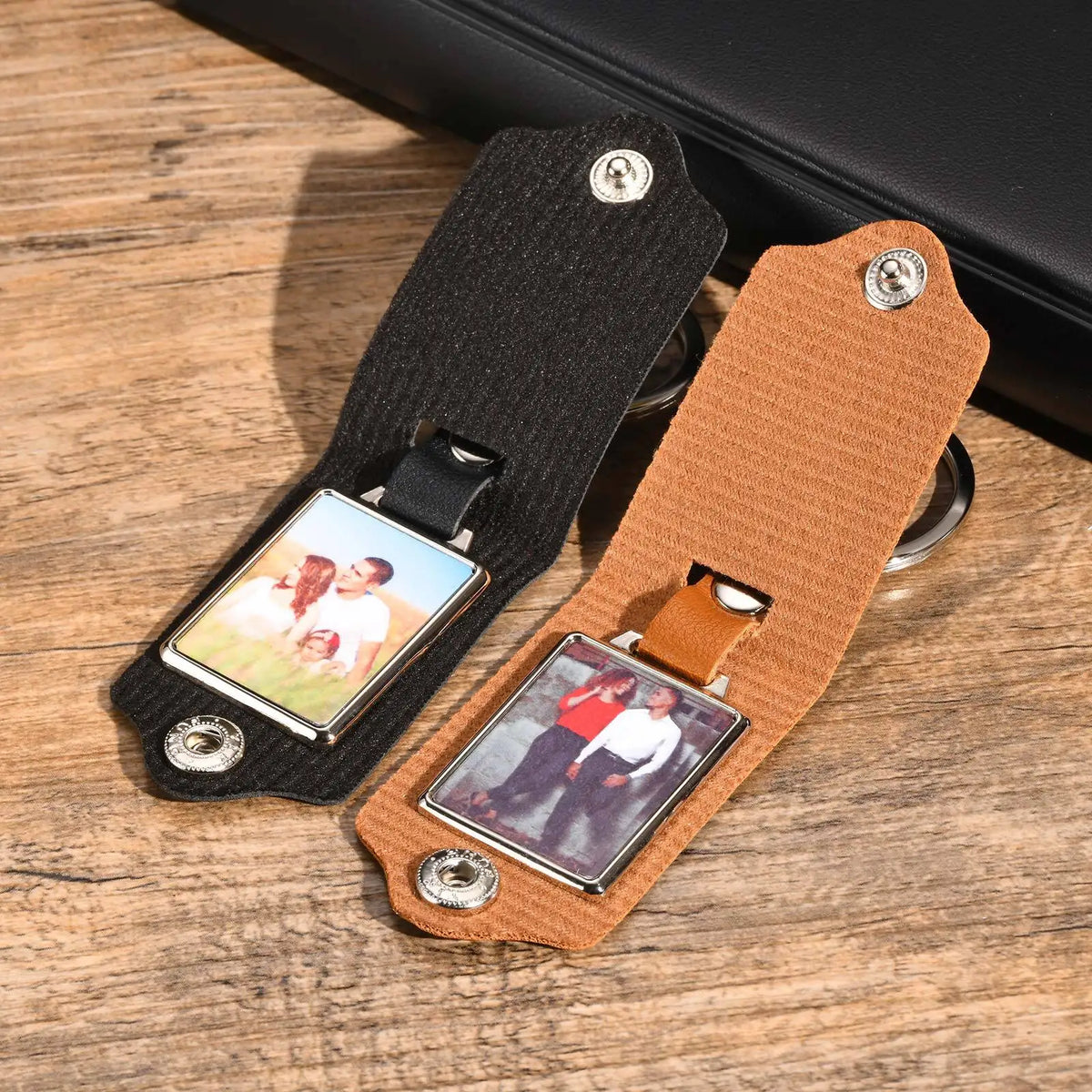 A brown leather keychain with a custom photo embedded in a black strap and silver hardware.