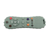 A silicone chew toy shaped like a remote control with various colored buttons and controls.