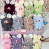 A collection of fluffy bunny plush toys in various pastel colors and shades.