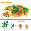 A set of green and orange building blocks shaped like cherry blossom trees, including various pieces.