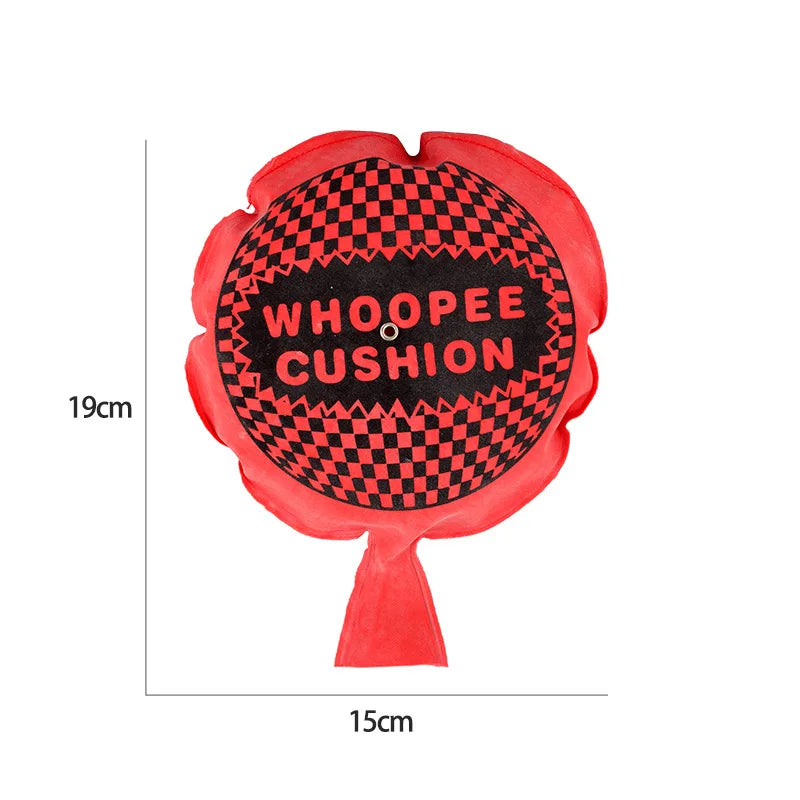 A red, flower-shaped Whoopee Cushion prank toy with a black and pink checkered pattern.