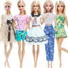 Five fashion dolls wearing various casual outfits and hairstyles.