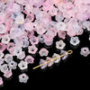 A pile of pink and purple gradient bellflower acrylic beads for jewelry making
