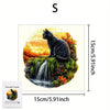 A black cat sitting on a mossy rock with a waterfall, part of a wooden jigsaw puzzle.