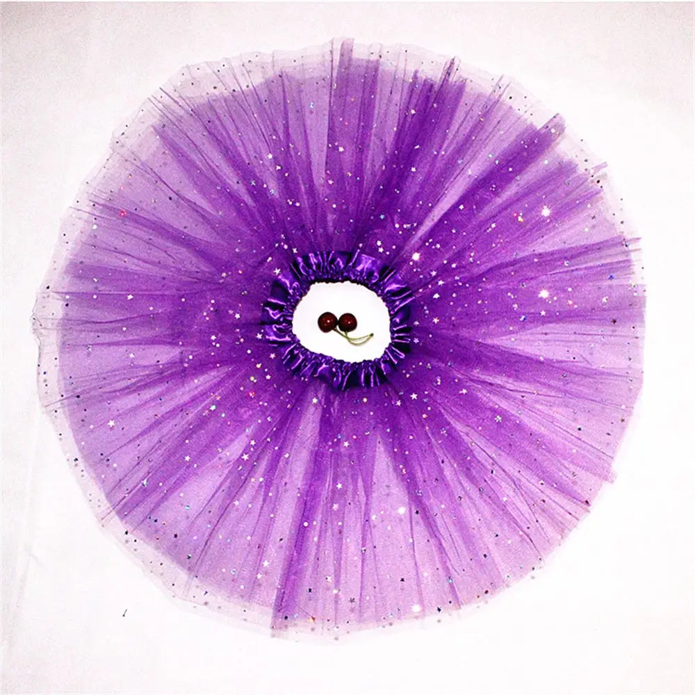 A purple sparkling tutu dress for girls with a layered tulle skirt and a face design.
