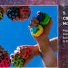 Hands holding various colored moon balls for bouncing games