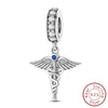 Sterling silver charm beads set featuring cross, angel, and evil eye designs for DIY jewelry making