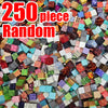 A pile of 250 random magnetic building cubes in various colors and patterns.