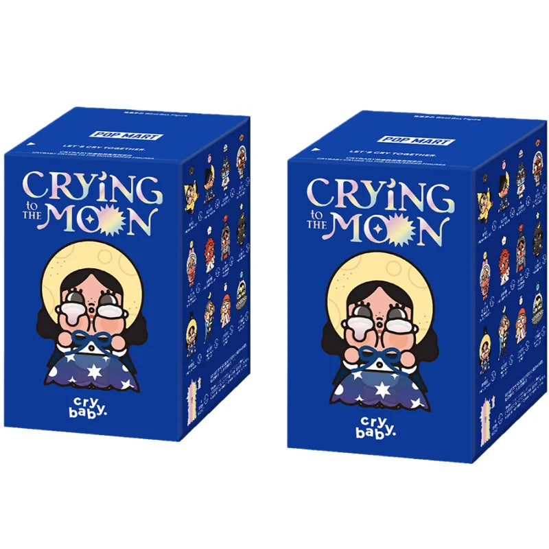 A blue box for a Crybaby Crying to the Moon collectible figurine featuring a woman with a yellow halo and tears.
