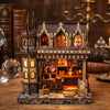 A detailed miniature kit of a wooden magic store cottage with furniture and architectural details.