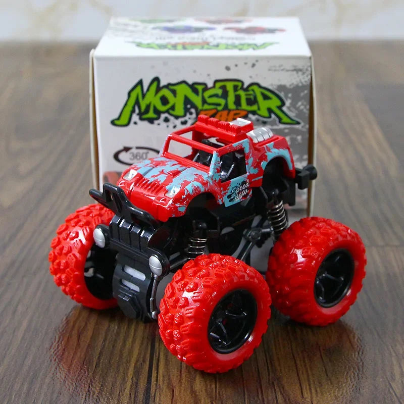 A red and black friction-powered monster truck toy sits in front of its packaging box.