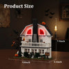 A detailed model of a haunted horror house built from white blocks with red accents and foliage.