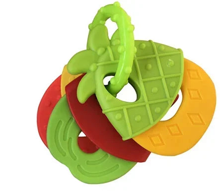 A set of green and orange silicone baby teethers shaped like a pineapple and a slice of citrus fruit.