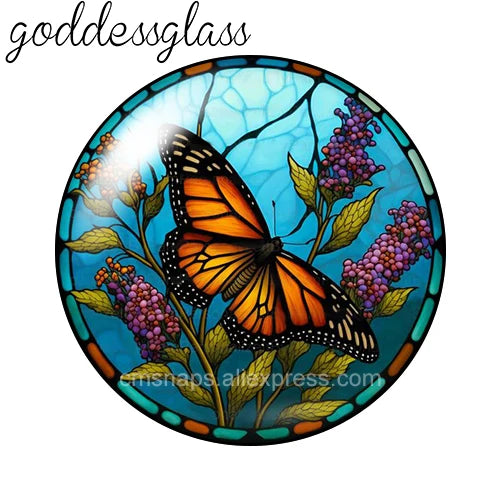 Round glass cabochons featuring an orange butterfly and purple flowers set in a blue background.