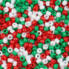 A close-up view of small, multicolor pony beads in various shades of red, green, and white.