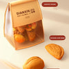 A box of Dianxin snack food, including a thousand-layer bread and a bread with butter.
